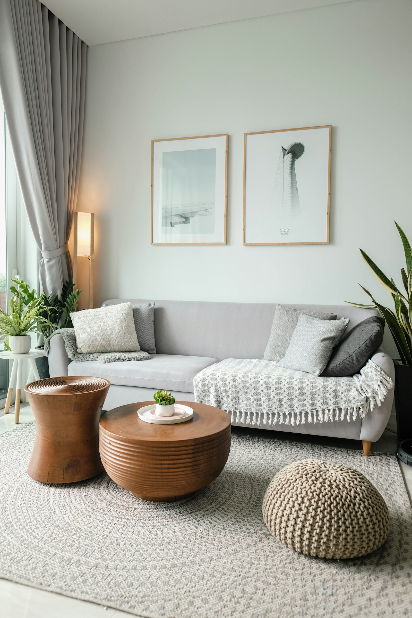 Soft grey sofa with wooden side tables