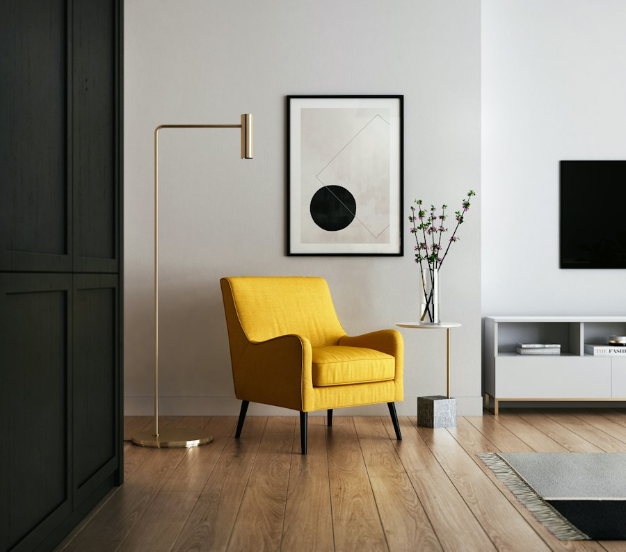 Yellow armchair beside a brass floor lamp